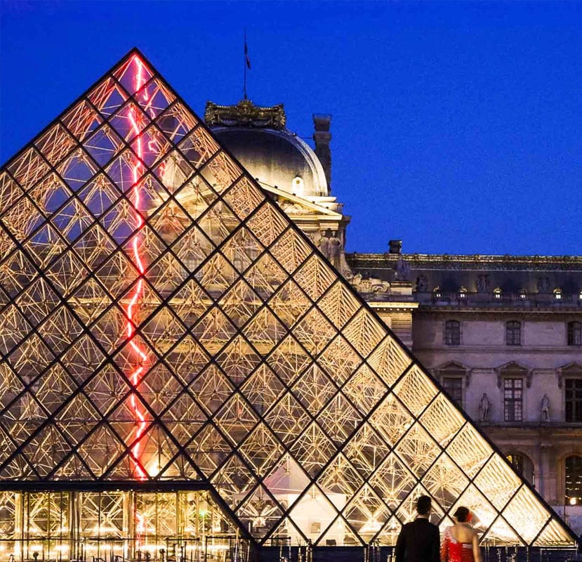The Louvre Pyramid in Paris at night