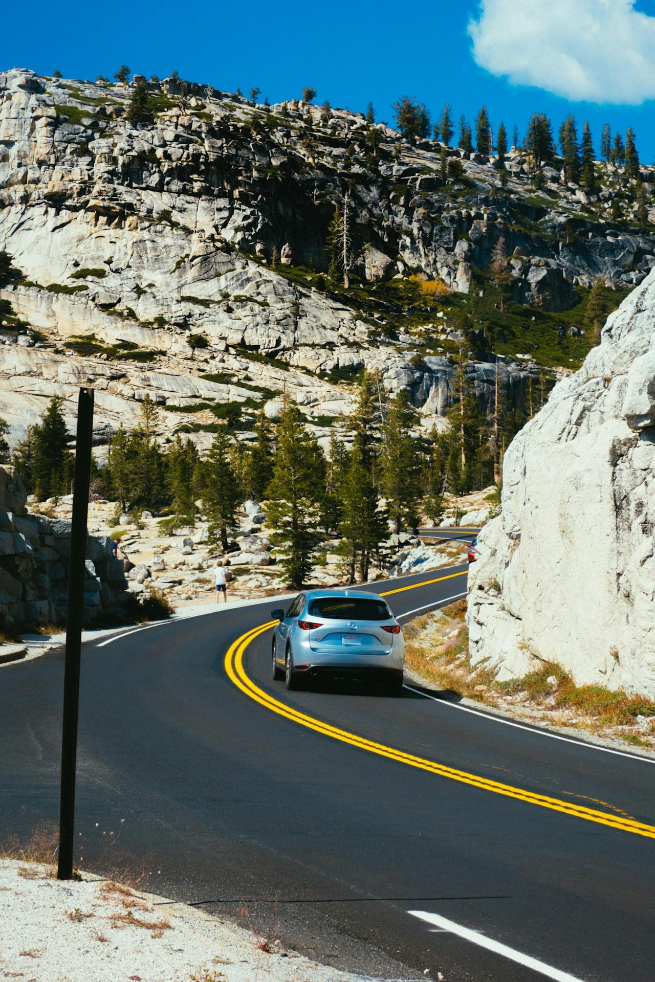A car driving through the mountains
